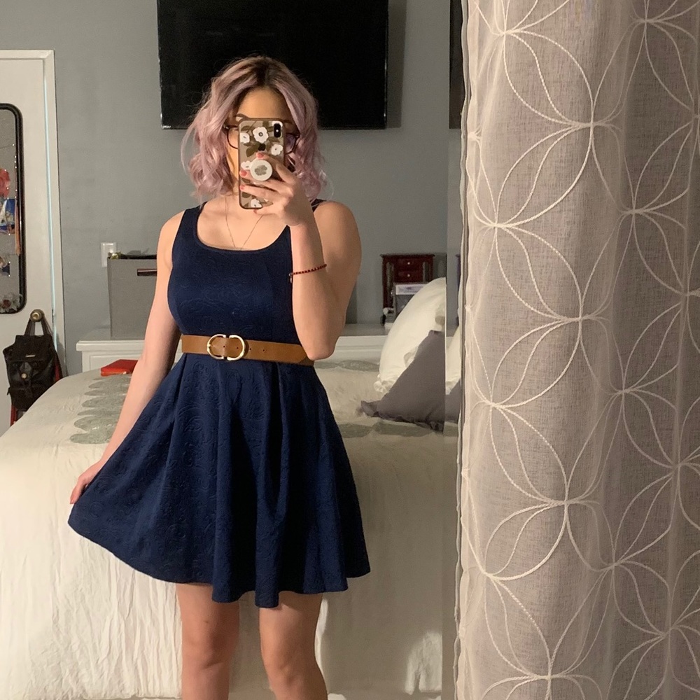 Woman’s navy blue dress